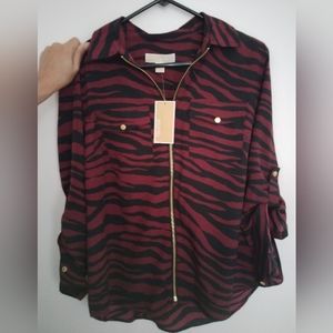 A Michael Kors burgundy and black zipper front shirt in size large